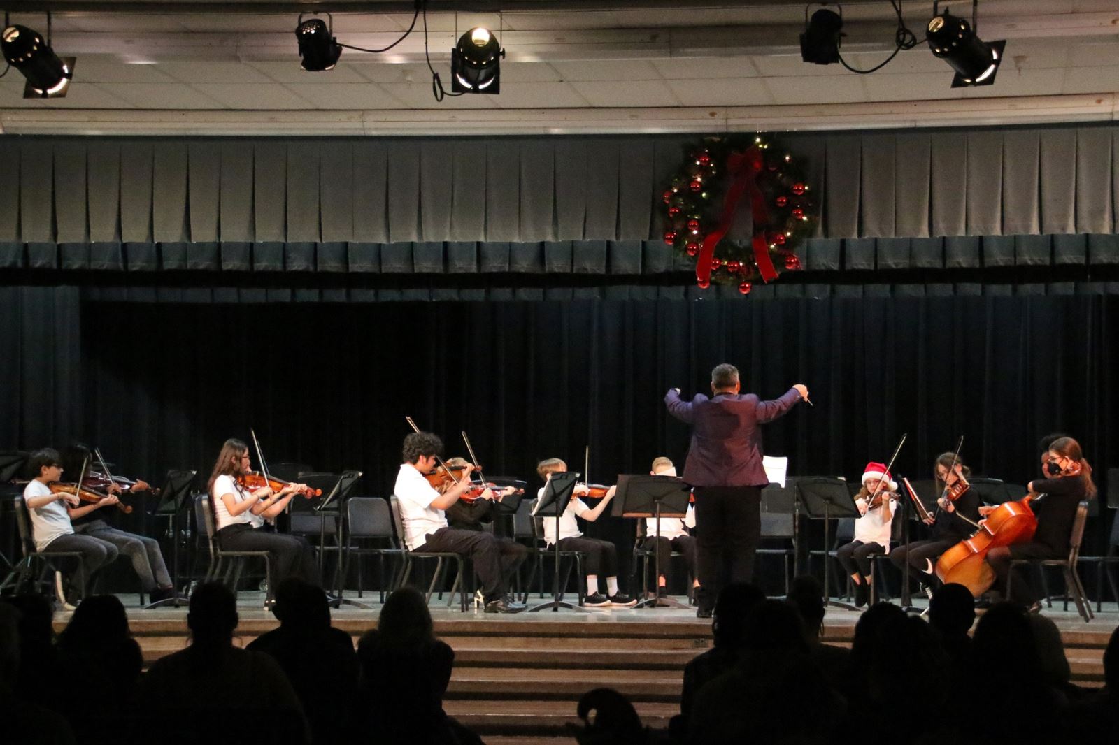 Orchestra Students hosding their Instuments